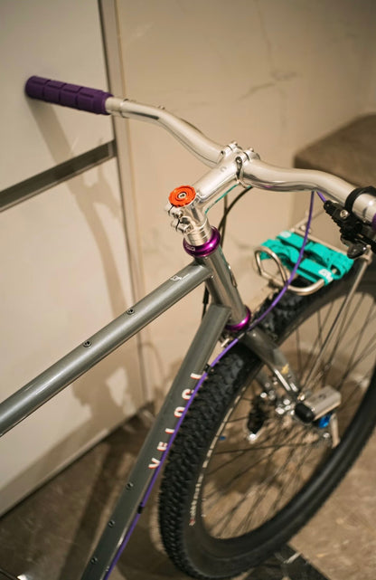 Close-up of a VLCmade Open Bar cockpit with purple grips