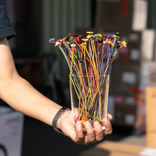 GHOOOST Twist Flowers — assorted handmade wire flowers arranged on handlebars