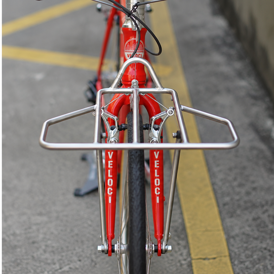 VLCmade Rocket Light silver front rack mounted on a red bicycle, front view