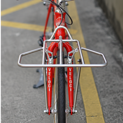 VLCmade Rocket Light silver front rack mounted on a red bicycle, front view